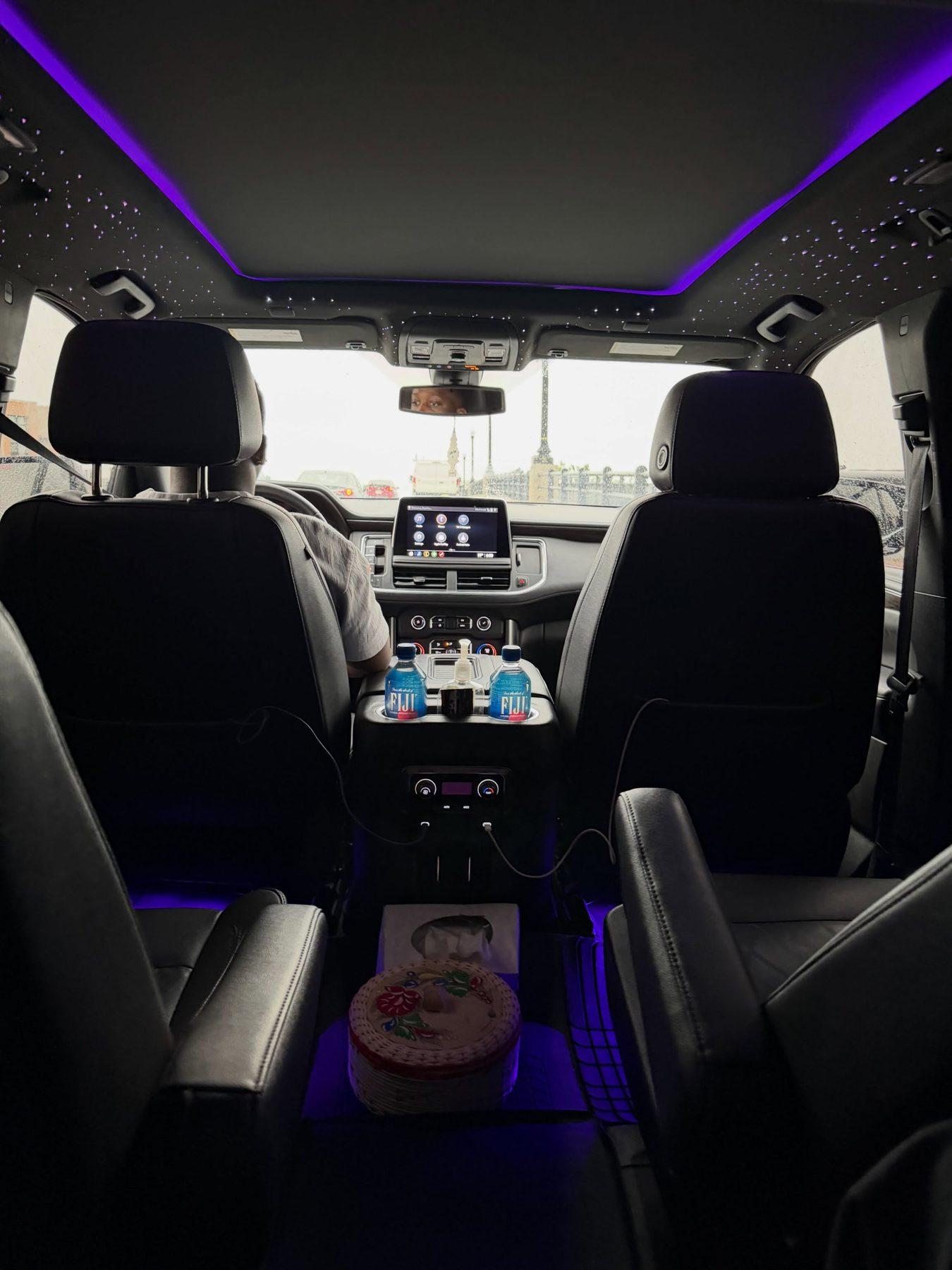 Executive SUV cabin lit by a fiber-optic starlight headliner